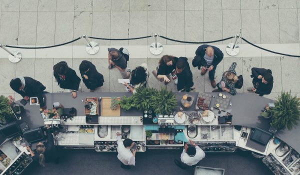 aerial view photography of people lining-up at the food counter