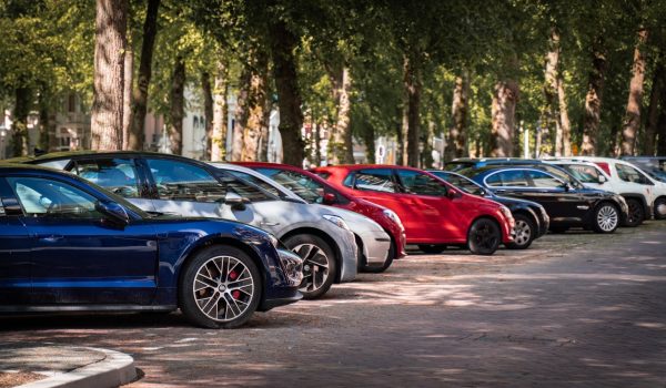 blue and red sports car on road during daytime