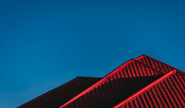 red and black building under blue sky